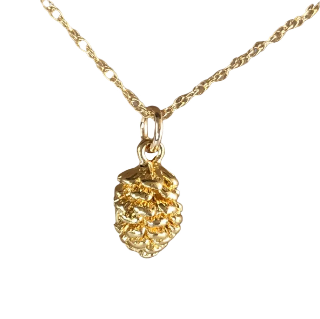 A gold-filled necklace with a pine cone charm.